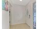 Bright and airy foyer with tile flooring and white door at 5076 Kingsley Rd, North Port, FL 34287