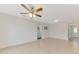 Spacious living room with ceiling fan and tile flooring at 5076 Kingsley Rd, North Port, FL 34287