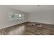 Spacious bedroom with large windows, hardwood floors, and a walk-in closet at 5076 Kingsley Rd, North Port, FL 34287