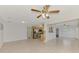Open living room with a view of the kitchen and dining area at 5076 Kingsley Rd, North Port, FL 34287