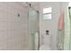 Clean bathroom with a walk-in shower and updated fixtures at 5076 Kingsley Rd, North Port, FL 34287