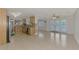 Open concept kitchen and dining area with tile floors at 5076 Kingsley Rd, North Port, FL 34287
