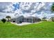 House with spacious backyard, pool, and patio at 5076 Kingsley Rd, North Port, FL 34287