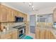 Stylish kitchen with stainless steel appliances and granite countertops at 5076 Kingsley Rd, North Port, FL 34287