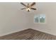 Bright bedroom featuring wood-look floors and ceiling fan at 5076 Kingsley Rd, North Port, FL 34287