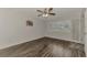 Bedroom with wood-look floors and exterior access at 5076 Kingsley Rd, North Port, FL 34287