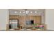 Kitchen features wood cabinets, granite counters, and stainless steel appliances at 5076 Kingsley Rd, North Port, FL 34287