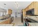 Bright kitchen with stainless steel appliances and granite countertops at 5076 Kingsley Rd, North Port, FL 34287