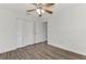 Bright bedroom with wood-look floors and built-in closet at 5076 Kingsley Rd, North Port, FL 34287