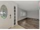Bright entryway with wood-look flooring and white door at 5076 Kingsley Rd, North Port, FL 34287