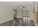 Bright dining room with wood-look floors and access to a back patio at 5076 Kingsley Rd, North Port, FL 34287