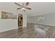 Open living area with hardwood floors and kitchen views at 5076 Kingsley Rd, North Port, FL 34287