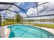 Screened pool with lake view at 4762 Escalante Dr, North Port, FL 34287