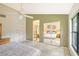 Main bedroom with ensuite bath and mirrored closet at 338 Pembroke Dr # 208, Venice, FL 34293