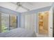Guest bedroom with patio access and built-in closet at 338 Pembroke Dr # 208, Venice, FL 34293