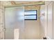 Shower with frosted glass door and bamboo wallpaper at 338 Pembroke Dr # 208, Venice, FL 34293