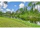 Peaceful canal-front view with lush greenery at 338 Pembroke Dr # 208, Venice, FL 34293