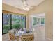 Kitchen boasts a breakfast nook and a view of the sunroom at 338 Pembroke Dr # 208, Venice, FL 34293