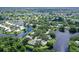 Aerial view of a community with houses, lakes, and lush landscaping at 338 Pembroke Dr # 208, Venice, FL 34293