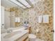 Bathroom with bamboo wallpaper and updated vanity at 338 Pembroke Dr # 208, Venice, FL 34293