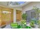 Inviting courtyard with seating and lush greenery at 338 Pembroke Dr # 208, Venice, FL 34293