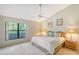 Spacious bedroom with king-size bed and large window at 338 Pembroke Dr # 208, Venice, FL 34293