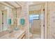 Bathroom with bamboo wallpaper and shower/tub combo at 338 Pembroke Dr # 208, Venice, FL 34293