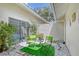 Private courtyard with seating area, perfect for relaxing outdoors at 338 Pembroke Dr # 208, Venice, FL 34293
