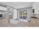 Modern kitchen features white cabinets, a large island, and stainless steel appliances at 12760 Brookgreen St, Venice, FL 34293