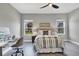 Bright bedroom with a comfortable bed and a workspace at 12760 Brookgreen St, Venice, FL 34293