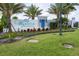 Community entrance sign with landscaping and palm trees at 12760 Brookgreen St, Venice, FL 34293
