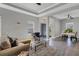 Open living room and dining area with neutral color palette and tile floors at 12760 Brookgreen St, Venice, FL 34293