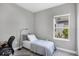 Small bedroom with twin bed, desk and chair at 12760 Brookgreen St, Venice, FL 34293