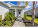 Welcoming entryway with brick walkway and lush landscaping at 12760 Brookgreen St, Venice, FL 34293