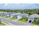 Aerial view of a community with houses, streets, and landscaping at 12760 Brookgreen St, Venice, FL 34293