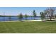 Scenic lakefront with walking path and lush green grass at 12760 Brookgreen St, Venice, FL 34293