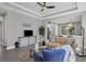 Open living room with a tan couch and a view to the kitchen at 12760 Brookgreen St, Venice, FL 34293