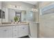 Modern bathroom with double vanity and a glass shower at 12760 Brookgreen St, Venice, FL 34293