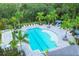 Community lap pool with surrounding lounge area and palm trees at 12760 Brookgreen St, Venice, FL 34293