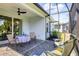 Enjoy this covered patio with outdoor furniture at 12760 Brookgreen St, Venice, FL 34293