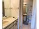 Bright bathroom with vanity, toilet and access to second bathroom at 929 Capri Isles Blvd # 22, Venice, FL 34292