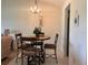 Cozy dining area with round table and four chairs at 929 Capri Isles Blvd # 22, Venice, FL 34292