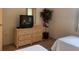 Guest bedroom with twin beds and wicker dresser at 929 Capri Isles Blvd # 22, Venice, FL 34292