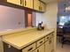 Kitchen boasts a breakfast bar and plenty of cabinet space at 929 Capri Isles Blvd # 22, Venice, FL 34292
