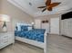 Spacious main bedroom with king-size bed and ceiling fan at 1319 Gondola Park Dr # 1319, Venice, FL 34292