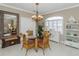 Charming dining room with glass table and wicker chairs at 1319 Gondola Park Dr # 1319, Venice, FL 34292