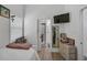 Cozy bedroom with a full bed, built in shelving, and access to en-suite bathroom at 27000 Harrison Rd, Sidell, FL 34266