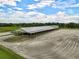 Aerial view of barn and riding arena at 27000 Harrison Rd, Sidell, FL 34266