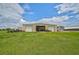 Large metal shed with double doors for tractors and equipment at 27000 Harrison Rd, Sidell, FL 34266