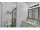 Clean bathroom with a walk-in shower, granite countertop, and updated fixtures at 27000 Harrison Rd, Sidell, FL 34266